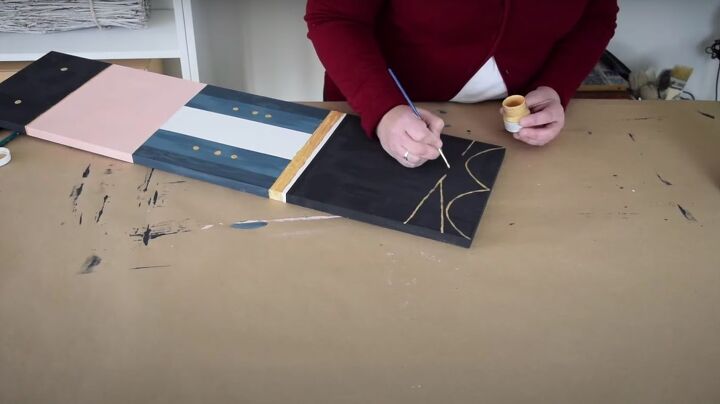 christmas dcor how to make a diy giant nutcracker, Painting gold laces onto the boots
