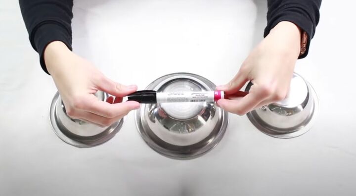 8 simple steps on how to make giant jingle bells, Black sharpie paint pen and silver mixing bowls