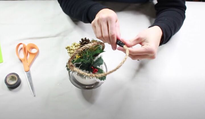 8 simple steps on how to make giant jingle bells, Reinforcing the ends of the rope closure with black electrical tape