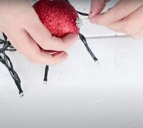 christmas decor how to make a beautiful diy ornament garland, Replacing the hook into the bauble