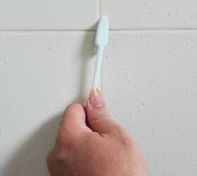 how to remove paint from tile, hand scrubbing grout with toothbrush