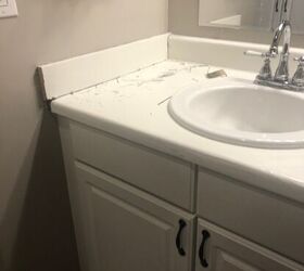 Tired of their old bathroom vanity, they found a budget-friendly way to make it look high-end