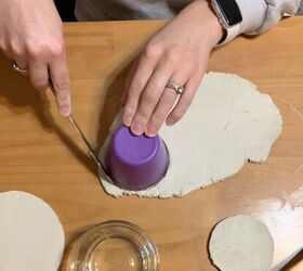 She presses a plastic cup into clay to make her tablescapes look stunning