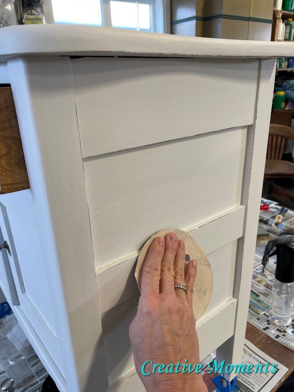 antique cabinet gets white refinish