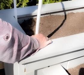 She sticks PVC pipes into her raised bed for this clever way to keep plants healthy