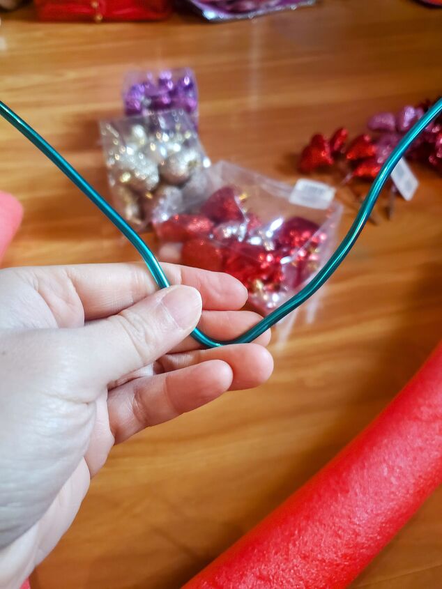 cute diy valentine s day heart shaped pool noodle wreath, Bending the multipurpose wire