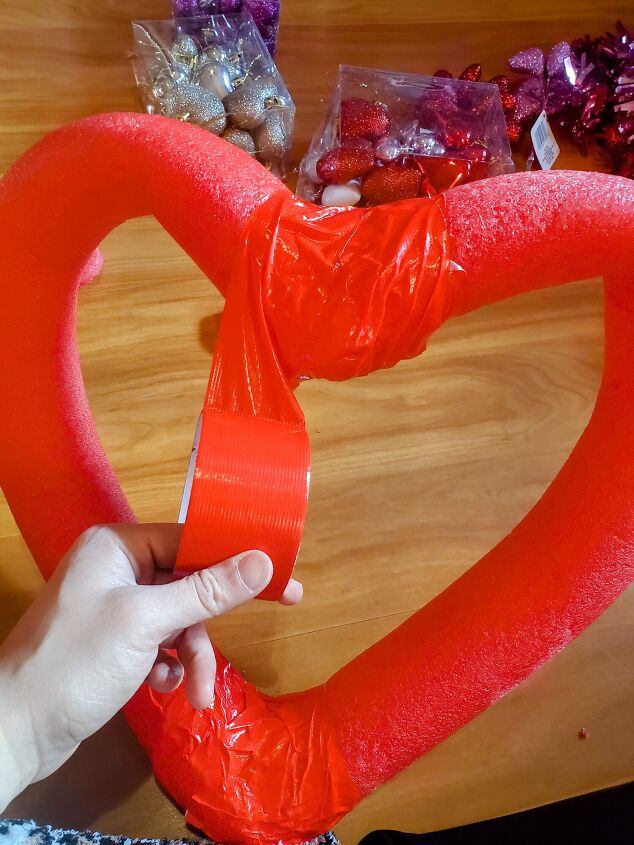 cute diy valentine s day heart shaped pool noodle wreath, Wrap the top part of wreath with duct tape