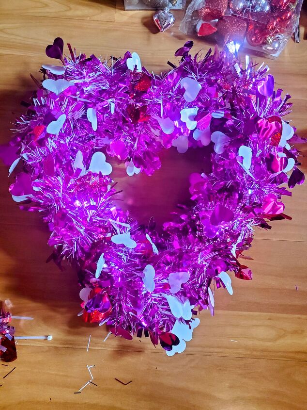 cute diy valentine s day heart shaped pool noodle wreath, Pool noodle wreath wrapped in tinsel garland