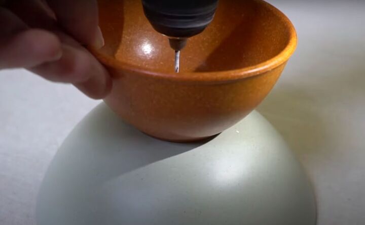 here are 6 easy steps to make the cutest bowl light for your home, Drilling through the two bowls