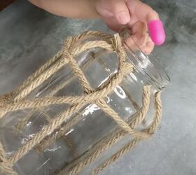 how to make a diy lantern ornament out of waste materials, Gluing strips of rope to the rim of the jar