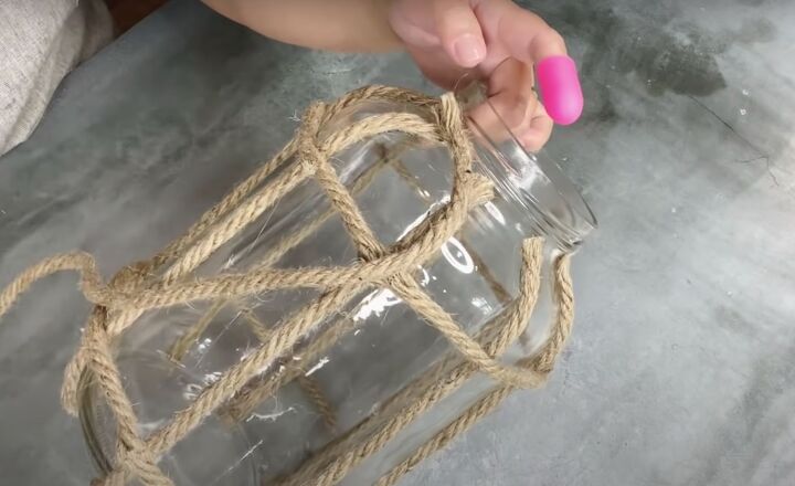 how to make a diy lantern ornament out of waste materials, Gluing strips of rope to the rim of the jar