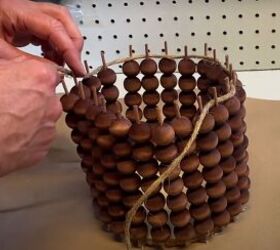 decorate your home with this unique diy beaded flower vase, Weaving twine around the exposed dowel sticks