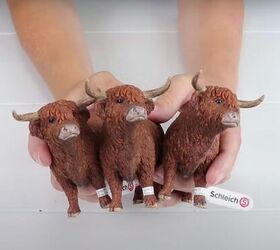 7 quick and easy steps to a farmhouse style diy candle stand, Three plastic highland bull toys