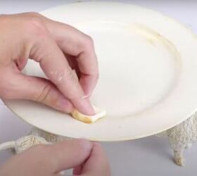 7 quick and easy steps to a farmhouse style diy candle stand, Applying gold wax to the inner rim of the plate