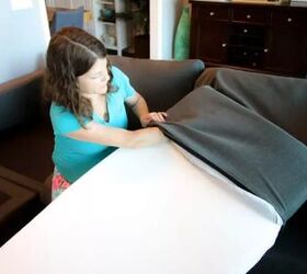how to restuff couch cushions and bring them back to life, woman inserting foam into gray couch cushion