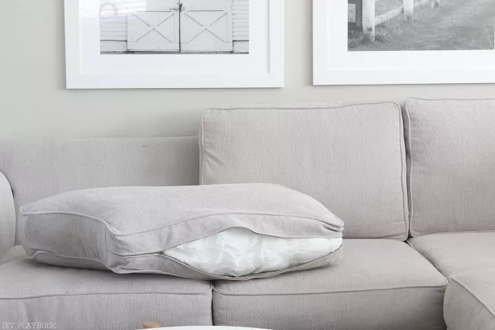 how to restuff couch cushions, unzipped gray couch cushion laid on a couch