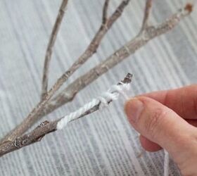 Twist some yarn around a branch to copy this warm, winter look