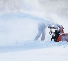 the 5 best snow blowers that ll get you through winter, Person using red snow blower Photo via Shutterstock
