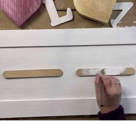 Glue popsicle sticks to a cabinet door to fill your kitchen with love this weekend