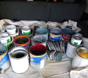 how to dispose of paint, several paint cans on drop cloth