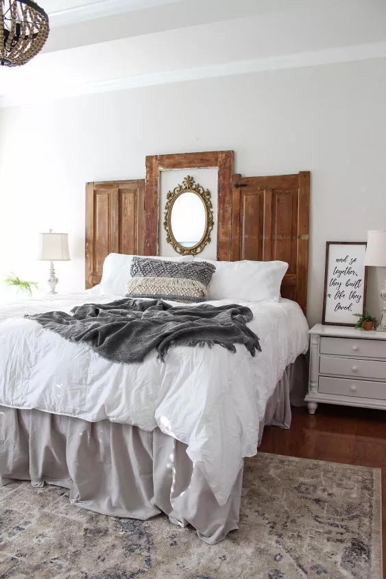 White bed with wood headboard / Photo via Heather Olinde