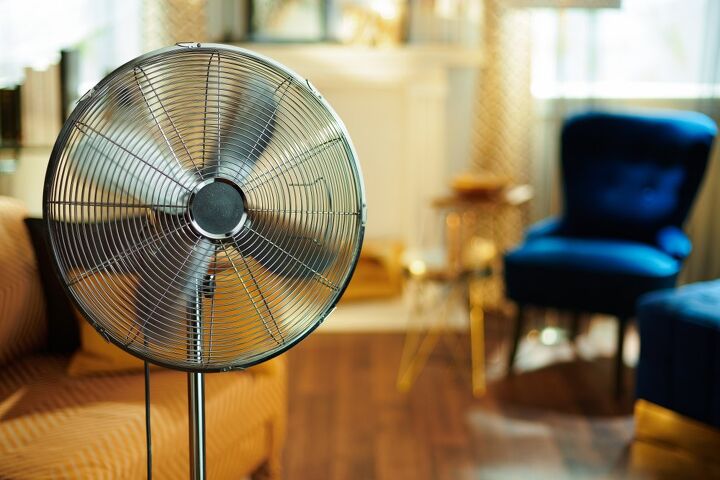 silver fan in a living room / Photo via Shutterstock
