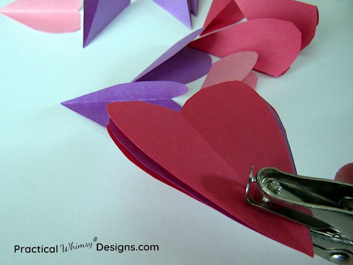 easy valentine s card flowers with suckers, Paper punching bottom of paper heart