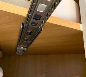 She hangs drawer slides underneath her kitchen cabinet shelves for a seriously smart organizing idea