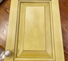 She took an old cabinet door and hung it on her wall (so pretty!)