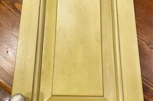 She took an old cabinet door and hung it on her wall (so pretty!)