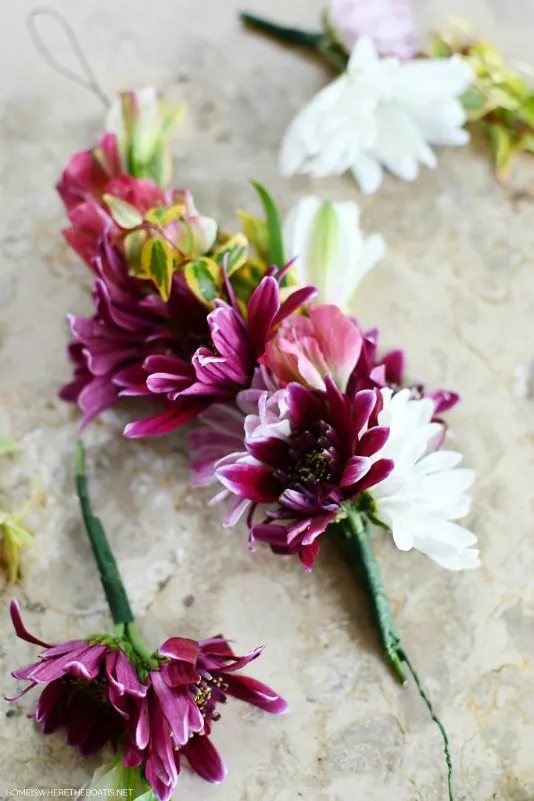 how to make a flower crown in 7 simple steps, multicolor flowers around green wire