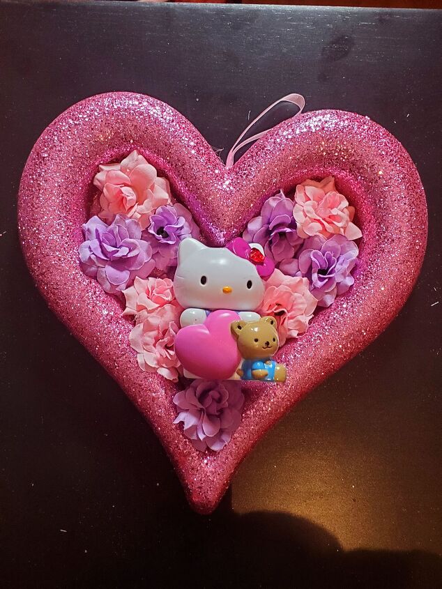 5 minute diy valentine s day hello kitty heart wreath, Gluing the mini artificial flowers