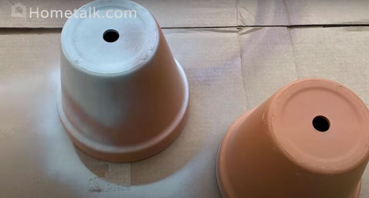 this cute diy birdbath is guaranteed to attract a few feathered friend, Terracotta pots being sprayed with spray paint