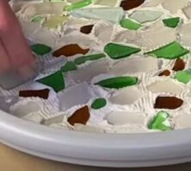 this cute diy birdbath is guaranteed to attract a few feathered friend, Pushing sea glass into wet tile adhesive