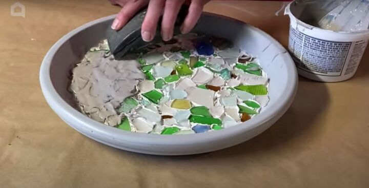 this cute diy birdbath is guaranteed to attract a few feathered friend, Adding grout over the sea glass
