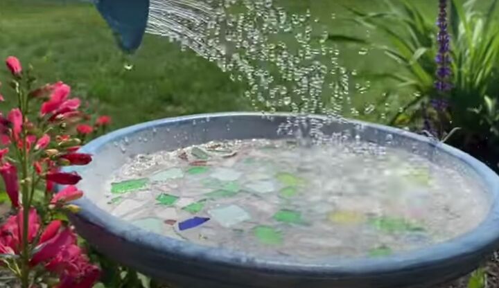 this cute diy birdbath is guaranteed to attract a few feathered friend, Adding water to the DIY birdbath