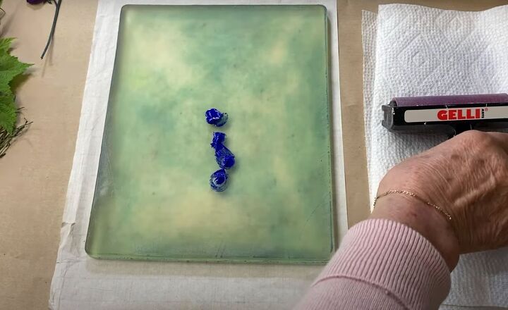 the surprisingly easy way to make your own botanical prints, Blobs of blue paint on a gel press printing plate