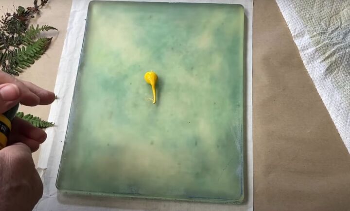 the surprisingly easy way to make your own botanical prints, A dollop of yellow paint on a gel press printing plate