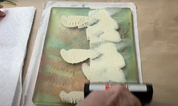 the surprisingly easy way to make your own botanical prints, Smoothing paint out onto a gel press printing plate with a brayer