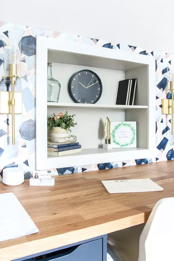 how to hang wallpaper, blue geometric print wallpaper around built in bookshelf