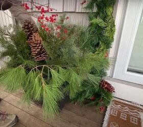 how to create this perfect pine and spruce outdoor winter planter idea, Adding red winter berries to the planter