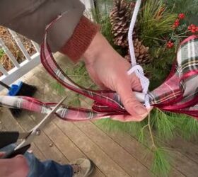 how to create this perfect pine and spruce outdoor winter planter idea, Securing a bow with a pipe cleaner