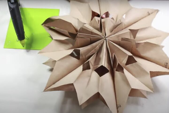 how to make this beautiful rustic paper bag snowflake craft, How to make paper bag snowflakes