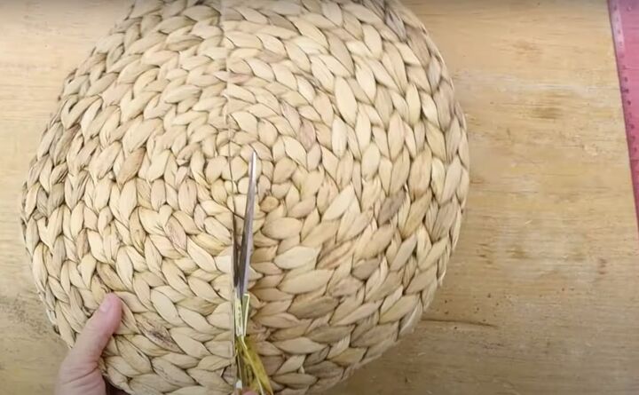 here s how to make gorgeous boho rainbow wall decor, Cutting the woven placemat in half