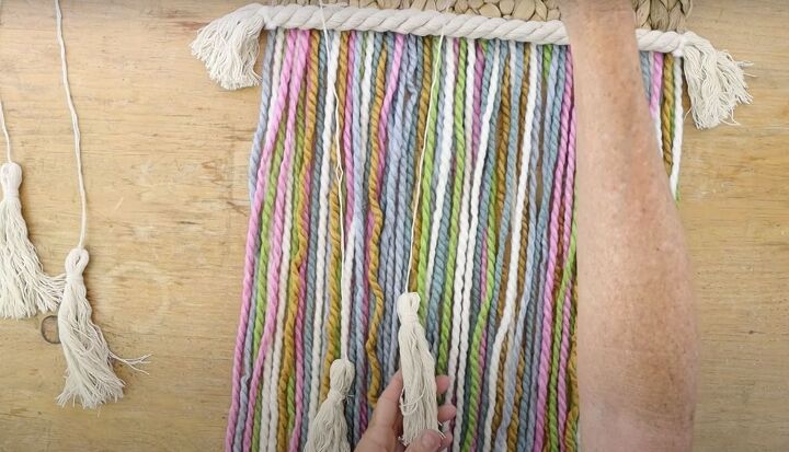 here s how to make gorgeous boho rainbow wall decor, Boho yarn wall hanging