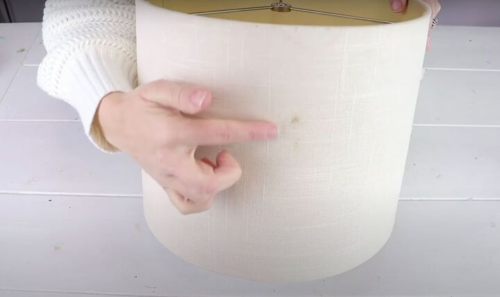 diy lampshade makeover how to create a glamorous lampshade, Pointing at stain on the thrifted lampshade