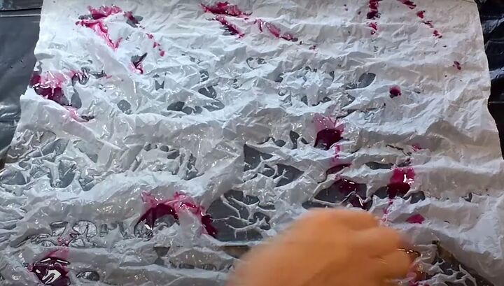 brighten storage bins with vibrant tie dyed tissue paper, Squirting red dye on wet tissue paper