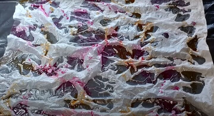 brighten storage bins with vibrant tie dyed tissue paper, Orange and red dye on wet tissue paper