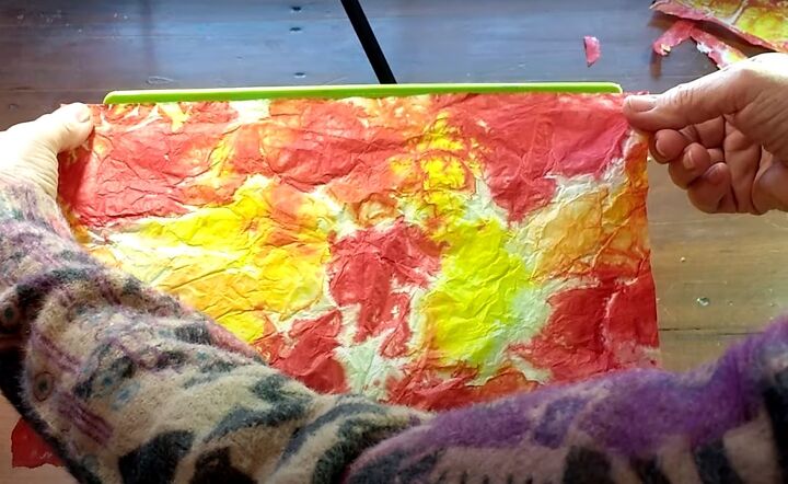 brighten storage bins with vibrant tie dyed tissue paper, Placing tie dyed paper onto another side of the box