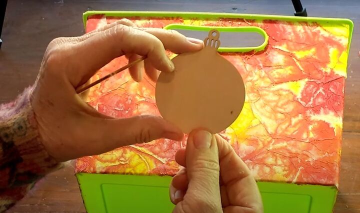 brighten storage bins with vibrant tie dyed tissue paper, A wooden ornament cutout